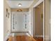 Inviting entryway with wood floors, a bright white door, and ample natural light at 1275 Rocky Ridge Trl, Salisbury, NC 28146