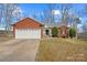 Cozy brick home featuring an attached garage, manicured shrubs, and a well-maintained lawn at 1275 Rocky Ridge Trl, Salisbury, NC 28146