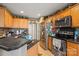 Functional kitchen with stainless steel appliances, tile flooring, and wooden cabinets at 1275 Rocky Ridge Trl, Salisbury, NC 28146