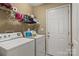 Bright laundry room with washer, dryer and plenty of storage at 1275 Rocky Ridge Trl, Salisbury, NC 28146