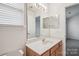 Bathroom featuring a vanity with a sink, a mirror, a toilet, and a shower over the toilet at 1386 Walnut Hill Dr, Rock Hill, SC 29732
