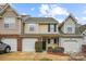 View of a townhome featuring neutral siding, a brick accent, and an attached garage at 1386 Walnut Hill Dr, Rock Hill, SC 29732