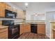 Well-organized kitchen with granite countertops, wood cabinets, and modern appliances at 1386 Walnut Hill Dr, Rock Hill, SC 29732