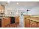 Efficient kitchen with granite countertops, wood cabinets, and view to the living room at 1386 Walnut Hill Dr, Rock Hill, SC 29732
