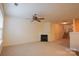 Living room featuring neutral carpet, fireplace, staircase, and ceiling fan at 1386 Walnut Hill Dr, Rock Hill, SC 29732