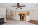 Open-concept living space connects to the kitchen, featuring neutral tones and a cozy fireplace at 1386 Walnut Hill Dr, Rock Hill, SC 29732