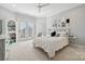 Inviting bedroom with a cozy bed, white decor, and a door to the outside at 145 Milford Cir, Mooresville, NC 28117