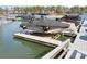 Boat on lift offers waterfront living and easy access to water activities on the lake at 145 Milford Cir, Mooresville, NC 28117