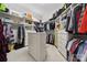 Well-organized walk-in closet with custom shelving, drawers, and ample storage space at 145 Milford Cir, Mooresville, NC 28117