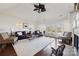 Open living room with wood floors, bright natural light, and a fireplace at 145 Milford Cir, Mooresville, NC 28117