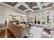 Spacious living room featuring coffered ceiling, hardwood floors, and large windows at 145 Milford Cir, Mooresville, NC 28117