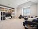 Open living room with built-in shelving, modern furniture, and recessed lighting at 145 Milford Cir, Mooresville, NC 28117