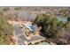 Aerial view showing a lake, parking, community pool, playground and tennis courts at 18016 Bluff Inlet Rd, Cornelius, NC 28031
