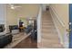View of living room, stairs and dining area at 18016 Bluff Inlet Rd, Cornelius, NC 28031