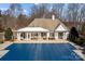 A covered community pool at the property featuring an outdoor entertainment area and covered patio at 18016 Bluff Inlet Rd, Cornelius, NC 28031