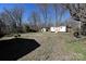 Large, grassy backyard featuring multiple storage sheds and mature trees at 1961 Franklin St, Rock Hill, SC 29732