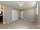 Comfortable bedroom featuring neutral walls, carpet, and a double-door closet for storage at 1961 Franklin St, Rock Hill, SC 29732