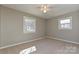 Bedroom featuring neutral walls, carpet, and two windows providing ample natural light at 1961 Franklin St, Rock Hill, SC 29732