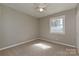 Neutral bedroom with carpet flooring, ceiling fan, and a window allowing natural light at 1961 Franklin St, Rock Hill, SC 29732