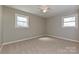 Cozy bedroom with plush carpeting and two windows providing ample natural light at 1961 Franklin St, Rock Hill, SC 29732