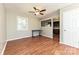 Dining area with hardwood floors, a view into the kitchen, and a bright window at 1961 Franklin St, Rock Hill, SC 29732