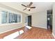 Bright living room with hardwood floors, a ceiling fan, and a view of the front door at 1961 Franklin St, Rock Hill, SC 29732