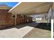 Covered patio of a brick home leading to a spacious backyard with a storage shed at 1961 Franklin St, Rock Hill, SC 29732