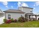 Well-maintained backyard with gray siding, gazebo, and red roses, creating a peaceful outdoor living space at 201 Bennett Trail Dr, Mount Holly, NC 28120