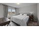 Well-lit bedroom features light colored walls and wood floors at 201 Bennett Trail Dr, Mount Holly, NC 28120