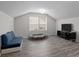 Well-lit bonus room features wood floors and lots of space at 201 Bennett Trail Dr, Mount Holly, NC 28120