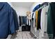 Walk in closet features wood floors and ample room to store clothes at 201 Bennett Trail Dr, Mount Holly, NC 28120