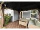 Inviting covered patio featuring comfortable seating, a coffee table, and string lights at 201 Bennett Trail Dr, Mount Holly, NC 28120