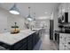 Modern kitchen with an island, white marble countertops, and stainless steel appliances at 201 Bennett Trail Dr, Mount Holly, NC 28120