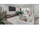 Spacious living room with a modern sectional, media console, and ample natural light at 201 Bennett Trail Dr, Mount Holly, NC 28120
