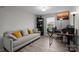 Bright office with a comfortable sofa, desk, and window, perfect for a productive work environment at home at 201 Bennett Trail Dr, Mount Holly, NC 28120