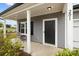 Inviting front porch featuring stylish seating and views of the landscaped front yard at 201 Bennett Trail Dr, Mount Holly, NC 28120
