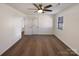 A naturally lit bedroom featuring neutral walls, plush carpet and ceiling fan at 205 Mauney St, Mount Holly, NC 28120