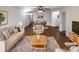 Bright living room with hardwood floors, ceiling fan, neutral paint and lots of space for entertaining at 205 Mauney St, Mount Holly, NC 28120