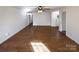 Spacious living room showcasing hardwood floors, neutral paint, and bright natural light at 205 Mauney St, Mount Holly, NC 28120