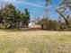 View of large backyard with retaining wall in the distance at 2286 Kilborne Dr, Charlotte, NC 28205
