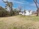 View of home and backyard with chainlink fence at 2286 Kilborne Dr, Charlotte, NC 28205