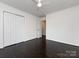 Neutral bedroom with hardwood floors and bright white closet at 2286 Kilborne Dr, Charlotte, NC 28205