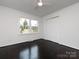 Bedroom features dark hardwood floors, neutral walls, and a closet for storage at 2286 Kilborne Dr, Charlotte, NC 28205