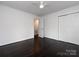 Clean bedroom features dark floors, a ceiling fan and a closet at 2286 Kilborne Dr, Charlotte, NC 28205