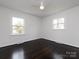Spacious bedroom featuring hardwood floors, two windows and crisp white trim at 2286 Kilborne Dr, Charlotte, NC 28205