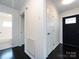 Hallway featuring neutral walls with white doors and black trim at 2286 Kilborne Dr, Charlotte, NC 28205