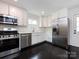 Charming kitchen featuring white cabinetry and stainless steel appliances at 2286 Kilborne Dr, Charlotte, NC 28205