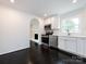 Updated kitchen with white cabinets, stainless steel appliances and dark floors at 2286 Kilborne Dr, Charlotte, NC 28205