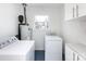 Laundry room features a washer, dryer, and cabinets at 2286 Kilborne Dr, Charlotte, NC 28205