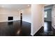 Open-concept living area with dark hardwood floors, recessed lighting, and fireplace at 2286 Kilborne Dr, Charlotte, NC 28205